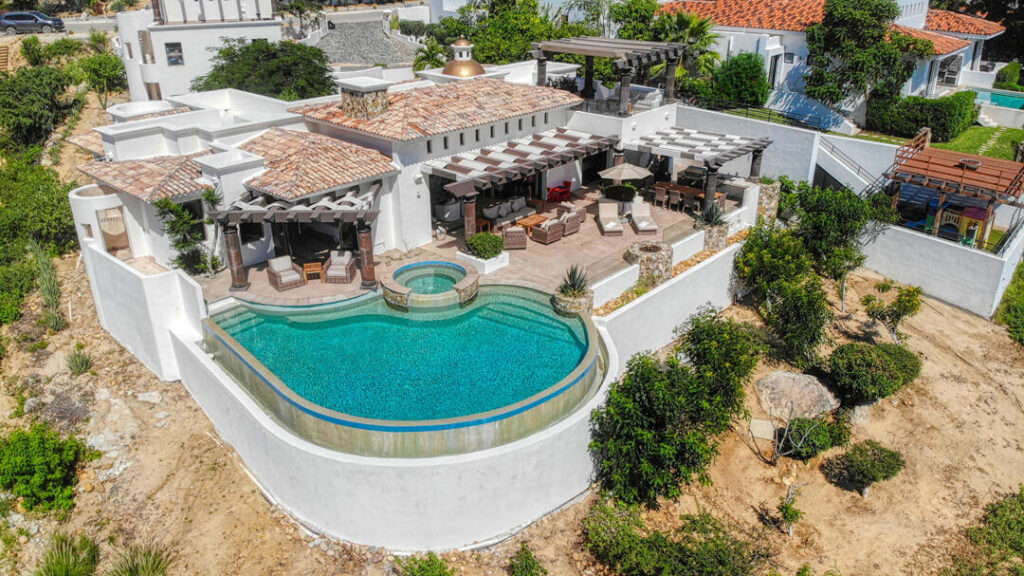 Los Cabos Park Hyatt Villa Mariposa is a stunning three-bedroom oceanfront retreat designed for those seeking privacy, tranquility, and timeless Baja elegance. Showcasing classic Hacienda-style architecture, the villa features rich wood furnishings, warm finishes, and tasteful pops of color that create an inviting and sophisticated atmosphere throughout.Wake up to the soothing sound of the waves and spend your days enjoying the private pool and hot tub overlooking the Sea of Cortez. The expansive terrace provides the perfect setting for al fresco dining, sunset cocktails, or simply relaxing while watching whales pass by during the season.The gourmet kitchen is equipped with high-end appliances and complemented by a charming breakfast nook. See more... The open-concept living and dining areas seamlessly connect to the spacious terrace, maximizing indoor-outdoor living and capturing breathtaking ocean – 115 La Noria, San Jose del Cabo, BS